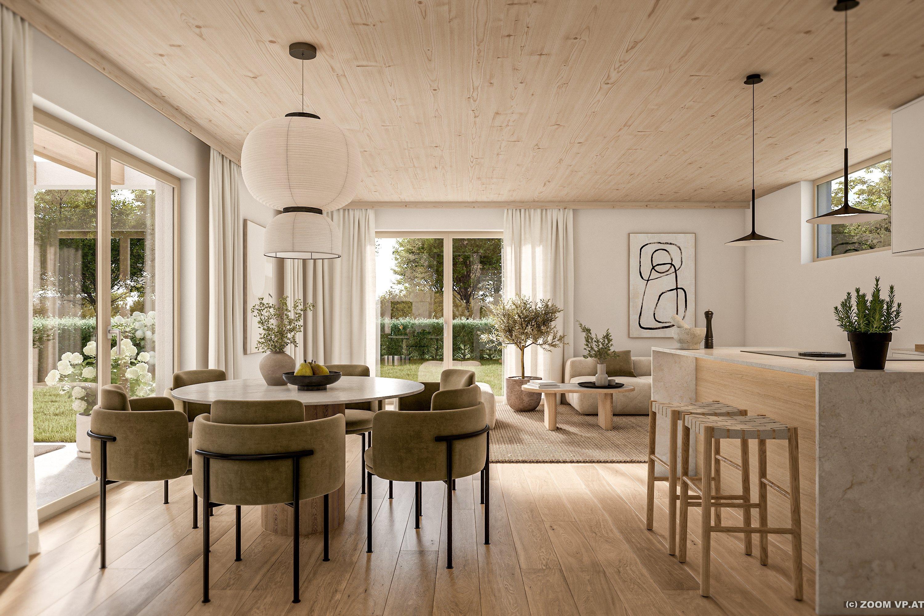 Offener Wohn-Küchenbereich mit rundem Esstisch und Blick in den Garten